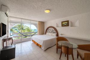 TV a/nebo společenská místnost v ubytování Hotel Maya Caribe Faranda Cancún