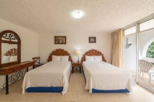Postel nebo postele na pokoji v ubytování Hotel Maya Caribe Faranda Cancún