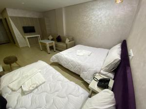 Postel nebo postele na pokoji v ubytování HOTEL CHARk