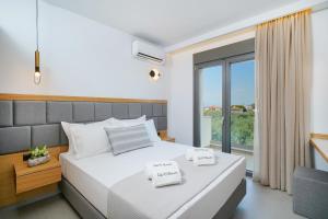 Olia Thassos - Luxury Apartments客房内的一张或多张床位