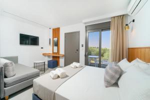 Olia Thassos - Luxury Apartments客房内的一张或多张床位