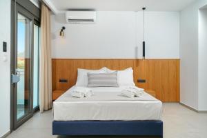Olia Thassos - Luxury Apartments客房内的一张或多张床位