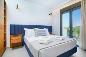Olia Thassos - Luxury Apartments客房内的一张或多张床位