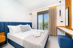 Olia Thassos - Luxury Apartments客房内的一张或多张床位