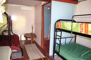 a room with two bunk beds and a table at The Spot in Esterillos