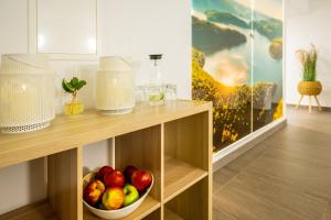 a bowl of fruit on a shelf in a room at Gemünder Ferienpark Salzberg in Schleiden