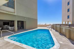 a swimming pool on the balcony of a building at Gulf House 202 in Gulf Shores