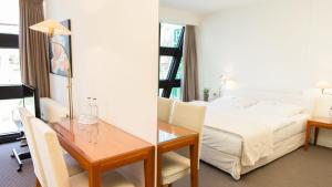Postel nebo postele na pokoji v ubytování Meyers Hotel Hittfeld