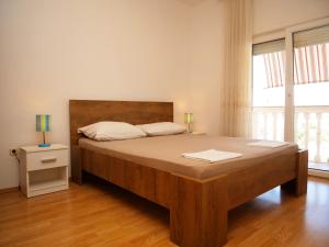Postel nebo postele na pokoji v ubytování Apartments Vlade