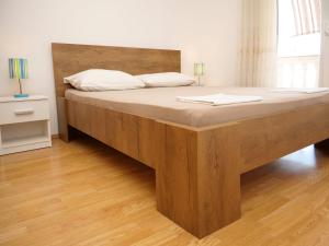 Postel nebo postele na pokoji v ubytování Apartments Vlade