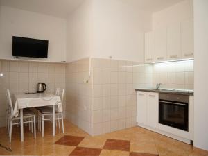 Kuchyň nebo kuchyňský kout v ubytování Apartments Vlade
