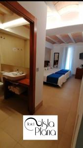 Postel nebo postele na pokoji v ubytování HOTEL ISLA PLANA