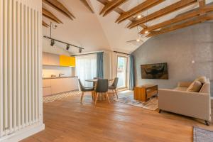 a living room with a table and a couch at premium suites Postavarului in Braşov