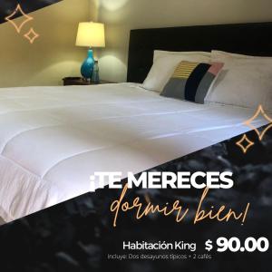 Ένα ή περισσότερα κρεβάτια σε δωμάτιο στο Sambo Mambo Beach Hotel