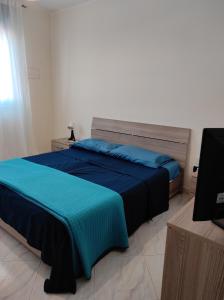 Säng eller sängar i ett rum på A casa di nonno Pino
