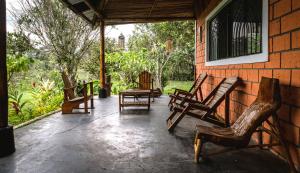 a group of chairs sitting on a patio at Selva Mayo in Moyobamba