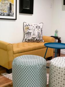 a living room with a couch and two tables at Wrigley Garden Unit in Chicago