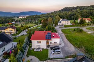 an aerial view of a house with solar panels on the roof at Pokoje Pod Dębowcem in Bielsko-Biala