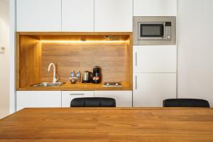 Kuchyňa alebo kuchynka v ubytovaní Minimal Rooms by ELE Apartments