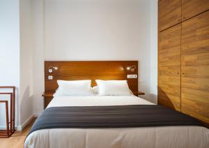 Posteľ alebo postele v izbe v ubytovaní Minimal Rooms by ELE Apartments