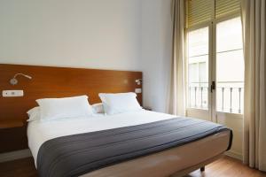 Posteľ alebo postele v izbe v ubytovaní Minimal Rooms by ELE Apartments