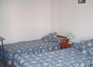 Cama o camas de una habitación en Hostal Casa Kolping