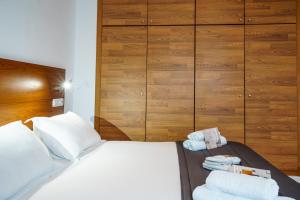 Posteľ alebo postele v izbe v ubytovaní Minimal Rooms by ELE Apartments