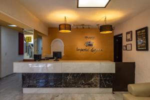 a lobby of a hotel with a reception desk at Hotel Imperial Laguna Faranda Cancún in Cancún