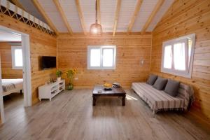 a living room with a couch and a table at Casa Nordica cerca del mar in El Palmar