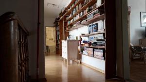 a hallway with a book shelf with books at Haus am Seerhein in Konstanz