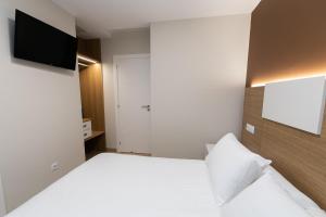 Łóżko lub łóżka w pokoju w obiekcie Palacios 30, Playa Nanín