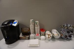 a counter with a coffee maker and other items on it at Crescent Bay Inn in Laguna Beach