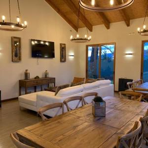 a living room with a table and a couch at Pucon villarrica in Pucón