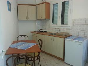 A kitchen or kitchenette at Efstathiou Mihail Studios and Apartments