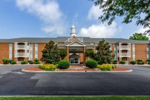 a large brick building with a church at Best Western Plus Inn at Hunt Ridge in Lexington