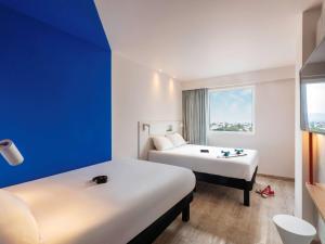 Giường trong phòng chung tại ibis budget Aguascalientes Norte