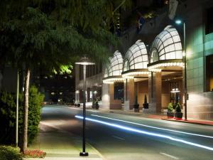 a street in front of a building at night at Fairmont Dallas in Dallas