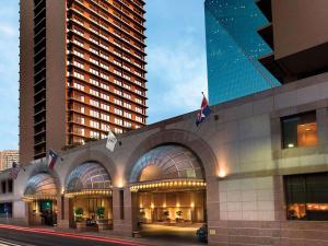 a building with two tall buildings in the city at Fairmont Dallas in Dallas