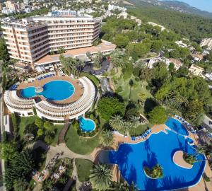 an aerial view of a resort with two pools at GPRO Valparaiso Palace & Spa in Palma de Mallorca