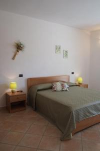 Postel nebo postele na pokoji v ubytování Agriturismo Sant'Anna