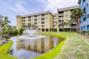a building with a fountain in the middle of a pond at Hilton Head Resort IV in Hilton Head Island