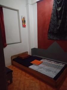 Ένα ή περισσότερα κρεβάτια σε δωμάτιο στο Apollo Hostel