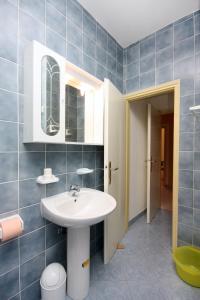 a bathroom with a sink and a mirror at Apartment Kampor 4972b in Kampor