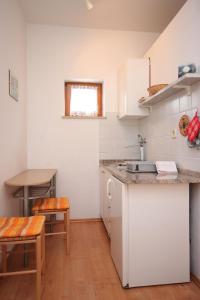 a kitchen with a sink and a counter top at Studio Kraj 7794b in Kraj