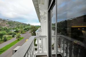 a balcony of a building with a view of a street at Crown Nguyen Hoang Hotel in Nha Trang