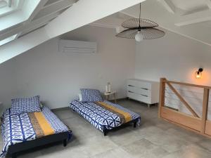 Krevet ili kreveti u jedinici u okviru objekta Sublime Loft au Coeur de Marigot, face de Anguilla