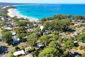 an aerial view of a suburb next to the beach at Aurora in Mollymook