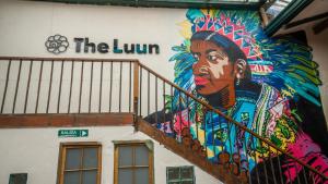 a painting of a woman on the side of a building at The Luun Hostel in Bogotá