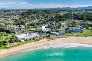 an aerial view of the beach and the ocean at Beachfront Five in Mollymook