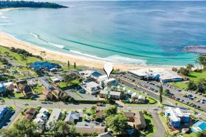 an aerial view of a town next to the beach at Beachfront Six in Mollymook